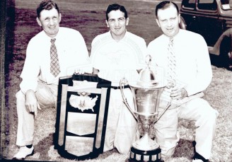 1935 National Champions – Coach Matty Bell, All-American Bobby Wilson, and Coach Jimmy Stewart