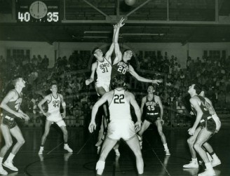 Tom Miller Goes For Tip-off Against Hogs