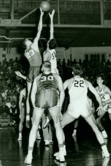 Tom Miller Jumps Against Texas As Art Barnes And Richard Bryant Watch